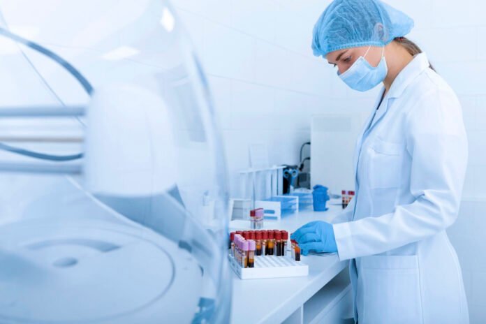 Woman collecting blood samples for testing on different diseases